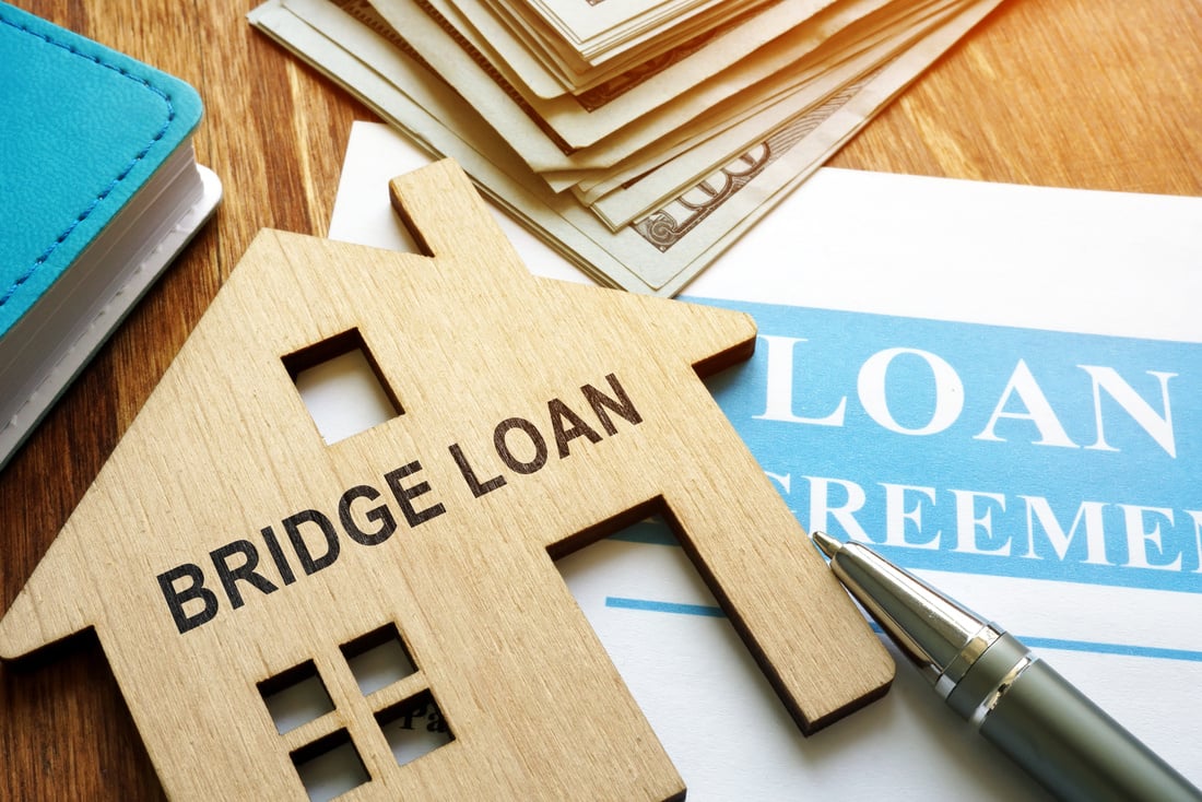 Bridge loan and mortgage agreement with pen.